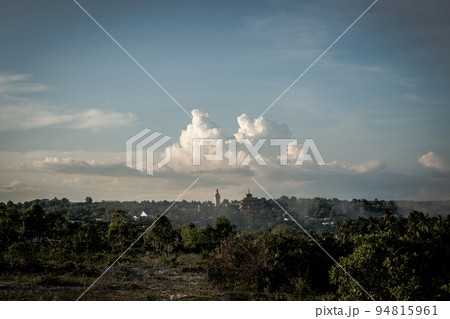 Atmosphere panorama cumulus white clouds over buddhist temple statue. Dramatic Sky Sunset Meditation background 94815961