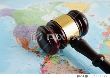 Bangkok, Thailand - May 15, 2022 Judges gavel on world map. 94823259