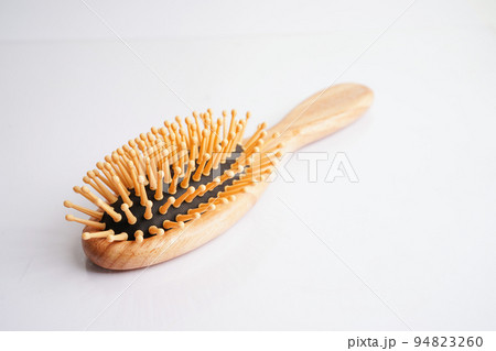 Hair loss fall with comb brush isolated on white background. 94823260