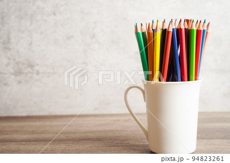 Colorful pencils in glass jar with copy space, learning university education concept. 94823261