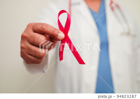 Asian woman doctor with pink ribbon, World Breast Cancer Day at October. 94823287