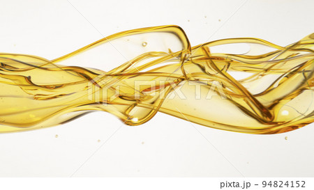 Freeze Motion Shot of Flowing Oil on White Background 94824152