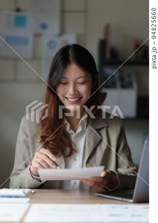 Businesswoman with many financial document to audit budget of company. tax, bill, account concept Businesswoman with many financial document to audit budget of company. tax, bill, account concept 94825660