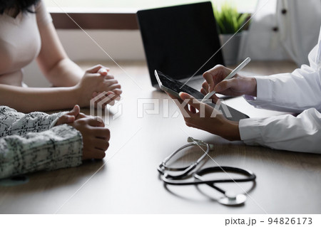 Doctor explain to patient about health care. Medicine and health care and insurance concept 94826173