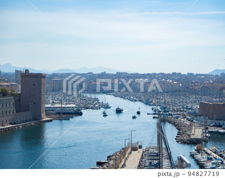 Marseille, France - May 15th 2022: Entrance towards the historic harbour Marseille, France - May 15th 2022: Entrance towards the historic harbour 94827719