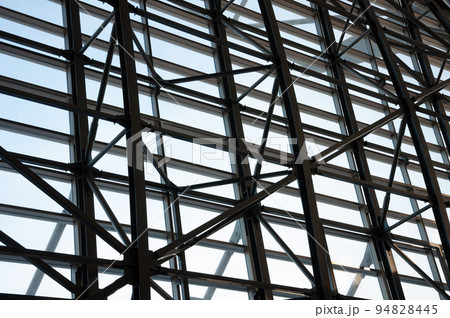 A view of the metal structures of the windows of the airport waiting room. A view of the metal structures of the windows of the airport waiting room. 94828445