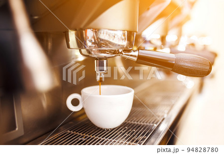 Coffee being prepared with an espresso machine 94828780