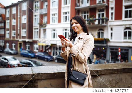 Beautiful stylish girl photographs scandinavian architecture. Travelling, lifestyle, adventure 94829739