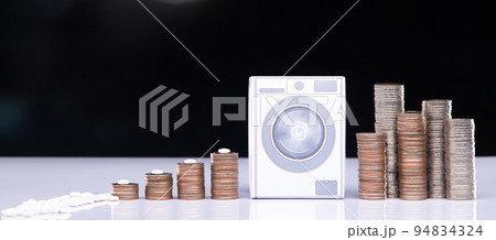 Drug Cartel change and clean money through washing machine or laundering tax system. It is illegal crime and be punished by law lawyer and authority. Concept fraud laundering money, Studio copy space Drug Cartel change and clean money through washing machine or laundering tax system. It is illegal crime and be punished by law lawyer and authority. Concept fraud laundering money, Studio copy space 94834324