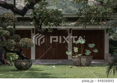 The front of A Thai pavilion architecture with beautifully garden and lotus flowers in ancient pots. 94836893