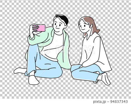 一對夫婦坐在地上，看著智能手機 94837343