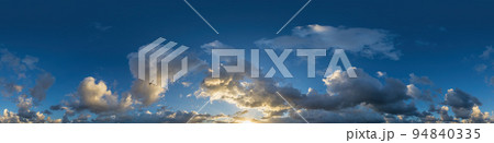 Dark blue sunset sky panorama with Cumulus clouds. Seamless hdr pano in spherical equirectangular format. Complete zenith for 3D visualization, game and sky replacement for aerial drone 360 panoramas. 94840335
