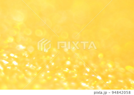 オレンジ色系背景　玉ボケ・丸ボケ　キラキラ 94842058
