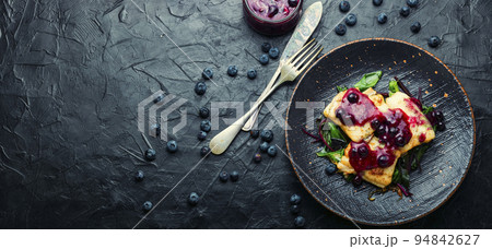 Baked pangasius fish with blueberries 94842627