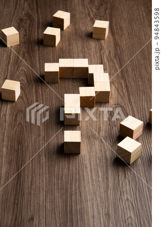 Forming bigger question mark. question mark on wooden table background Forming bigger question mark. question mark on wooden table background 94843598