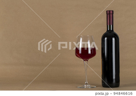Wine bottle and glass . Space for text. alcoholic drink Wine bottle and glass . Space for text. alcoholic drink 94846616