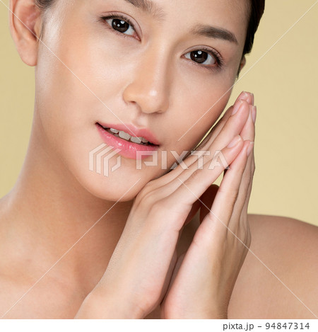 Closeup ardent young woman posing beauty gesture with clean fresh skin. Closeup ardent young woman posing beauty gesture with clean fresh skin. 94847314