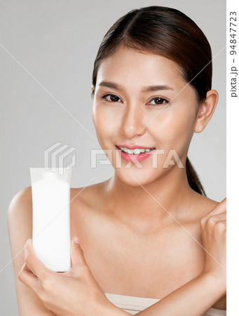 Closeup ardent woman smiling holding mockup product for advertising text place. 94847723