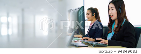 Business people wearing headset working in office in widen view 94849083
