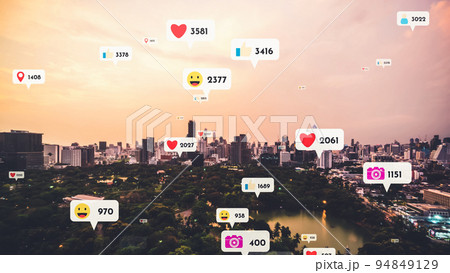 Social media icons fly over city downtown showing people reciprocity connection Social media icons fly over city downtown showing people reciprocity connection 94849129