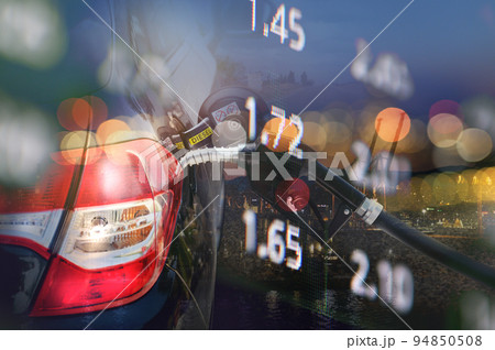 Fuel pump fill a tank of a car in a station Fuel pump fill a tank of a car in a station 94850508