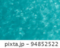 水色の光が輝く　キラキラな背景壁紙のイメージ 94852522