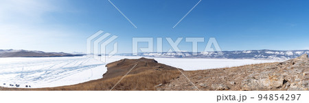 Winter landscape panorama with mountains and Lake Baikal in Siberia on sunny day. Natural background. 94854297