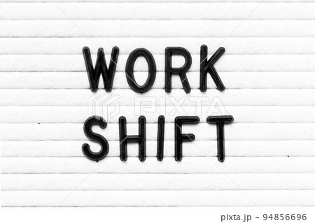Black color letter in word work shift on white felt board background 94856696