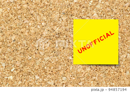 Yellow note paper with word unofficial on cork board background with copy space Yellow note paper with word unofficial on cork board background with copy space 94857194