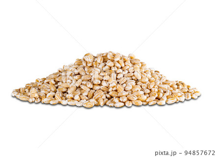 Pile of harvested dried pearl barley seeds isolated on white background. 94857672