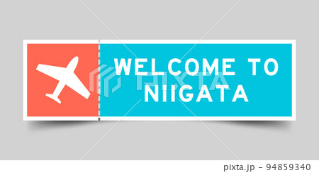 Orange and blue color ticket with plane icon and word welcome to niigata on gray background 94859340