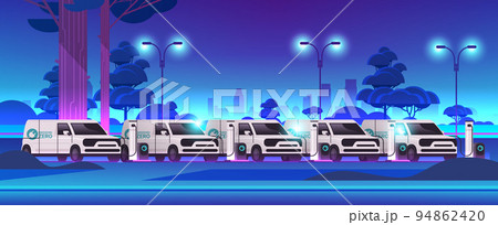 electric cargo vans charging battery vehicles at recharging power station charger EV management sustainable transport 94862420