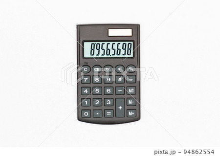 Calculator with big buttons with numbers on the digital screen on a white background. Isolated. Solar powered financial calculator. Electronic machine for math. Business office supplies. Close-Up Calculator with big buttons with numbers on the digital screen on a white background. Isolated. Solar powered financial calculator. Electronic machine for math. Business office supplies. Close-Up 94862554