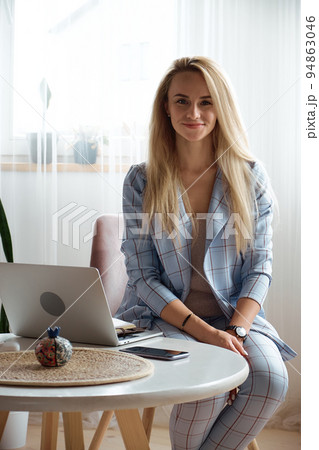 Portrait of a female psychologist or coach at the workplace, look at camera Portrait of a female psychologist or coach at the workplace, look at camera 94863046
