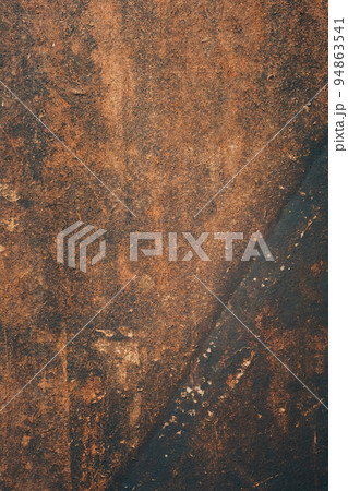 Wooden background. Aged texture. Brown board. Grunge dark cork desk with scratched surface and damages copy space for text logo. 94863541