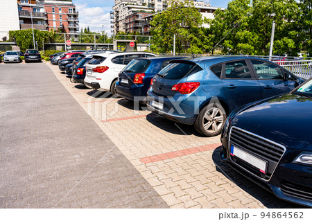 Parking garage. Empty road asphalt background. Car lot parking space in underground city garage. Modern underground parking. Parking garage. Empty road asphalt background. Car lot parking space in underground city garage. Modern underground parking. 94864562