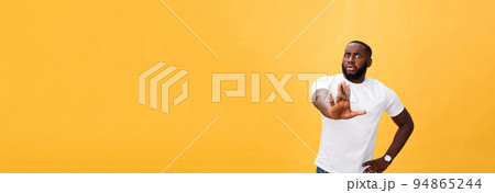 Portrait shock and annoyed displeased young man raising hands up to say no stop right there isolated orange background. Negative human emotion, facial expression, sign, symbol, body language 94865244