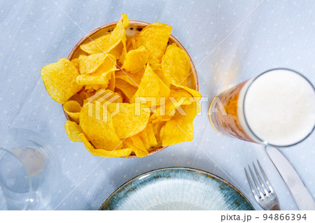 Appetizing chips with a glass of beer Appetizing chips with a glass of beer 94866394