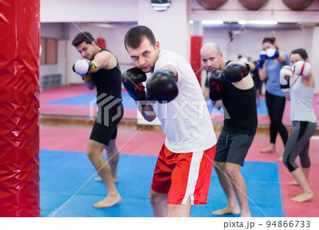 People practicing boxing punches People practicing boxing punches 94866733