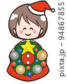 クリスマスリースを持つ笑顔の子供のイラスト 94867855