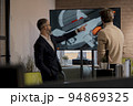 CEO of company studio developers of games discusses with the artist 3D model 94869325