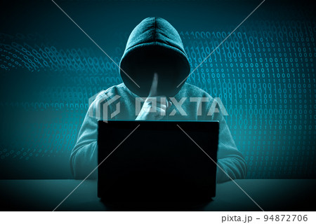 faceless hooded hacker showing silence gesture. Cyber attack, system breaking and malware. Internet crime and electronic banking security. dark digital background 94872706