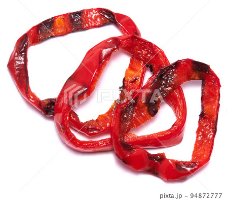 Grilled Slices of red pepper with stripes from a grill isolated on white background Grilled Slices of red pepper with stripes from a grill isolated on white background 94872777