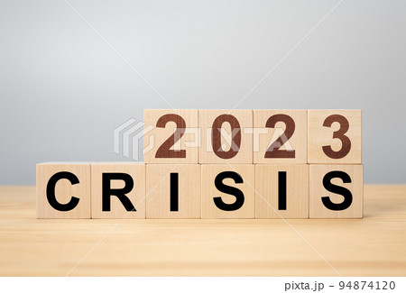 Crisis management concept in new year 2023 . Wooden cubes 2023 with text crisis. Bankruptcy and financial crisis concept. 94874120