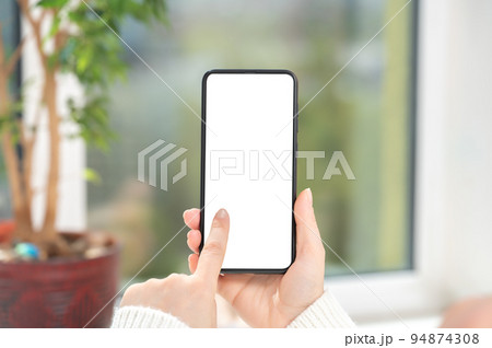 Cellphone mockup. woman user customer hold cellphone mockup with white screen in hand. Use mobile shopping app, check social media news, texting mobile sms order food delivery Cellphone mockup. woman user customer hold cellphone mockup with white screen in hand. Use mobile shopping app, check social media news, texting mobile sms order food delivery 94874308