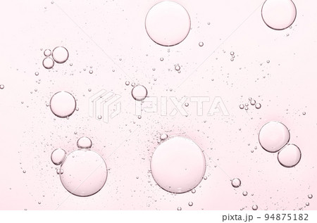 The texture of a cosmetic serum with bubbles in closeup. Macrophotography The texture of a cosmetic serum with bubbles in closeup. Macrophotography 94875182