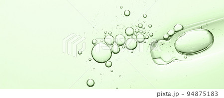 The texture of a facial serum or cosmetic gel. Close-up, macro photography The texture of a facial serum or cosmetic gel. Close-up, macro photography 94875183