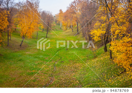 Autumn landscape, October park view with path under colorful deciduous trees 94878769