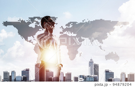 Concept of business success and control with confident boss against cityscape background Concept of business success and control with confident boss against cityscape background 94879204