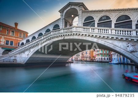 Rialto bridge at peaceful dramatic dawn and Grand Canal, Venice, Italy Rialto bridge at peaceful dramatic dawn and Grand Canal, Venice, Italy 94879235